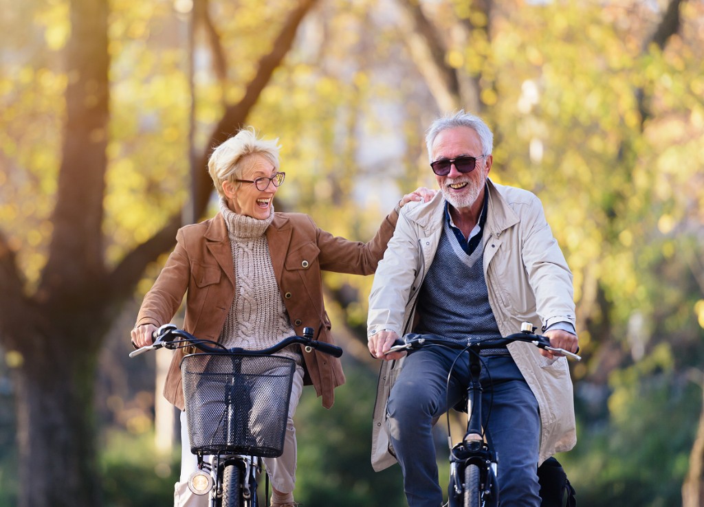 Woman sitting on a bench and wind blowing in the background